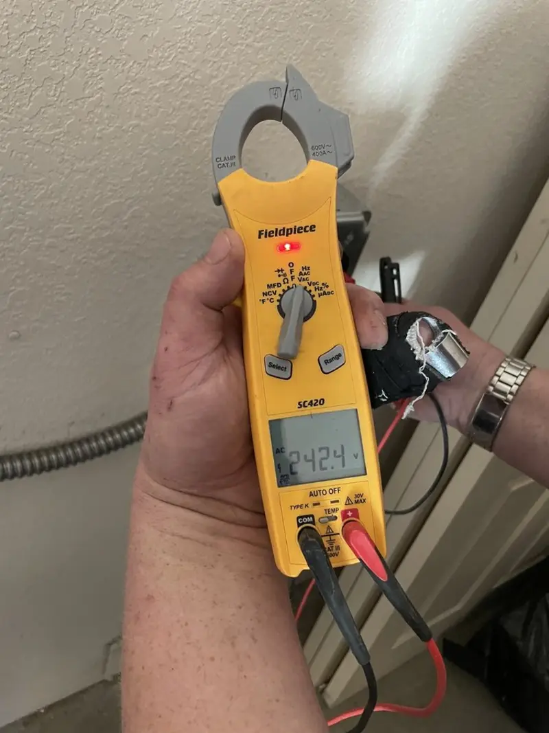 Voltage testing with clamp meter during Generator Installation in Maywood